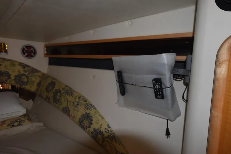 Slide: The Image of Interior cabin of 2002 Black Thunder 460 EC boat with remote holder and floral upholstery. - 22