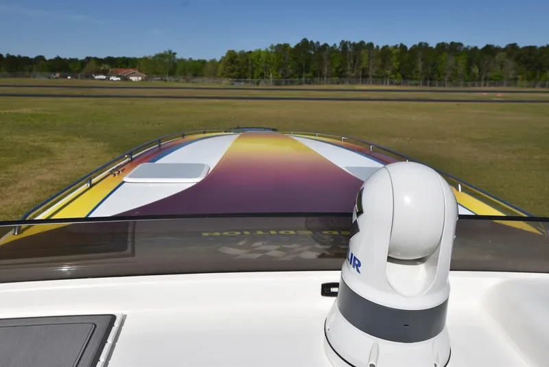 Slide: The Image of 2002 Black Thunder 460 EC boat with colorful deck design. - 24