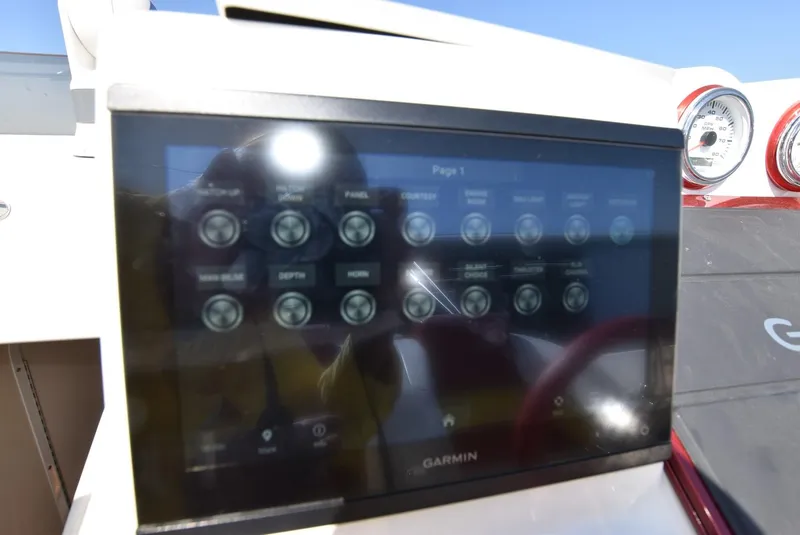 Slide: The Image of Garmin touchscreen display on 2002 Black Thunder 460 EC boat dashboard. - 34