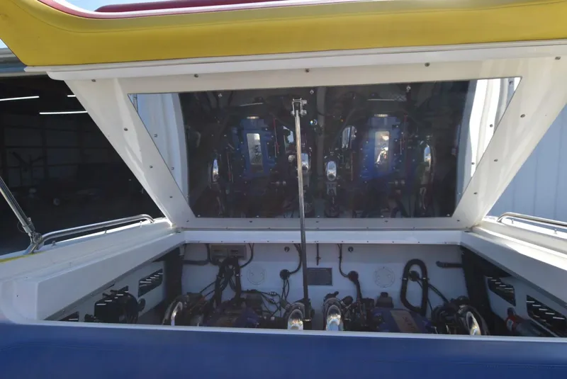 Slide: The Image of Open engine compartment of a 2002 Black Thunder 460 EC boat. - 35