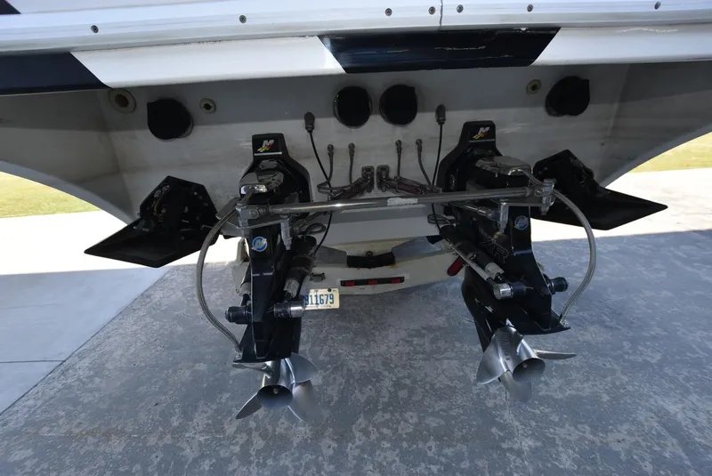 Slide: The Image of Rear view of a 2002 Black Thunder 460 EC boat showing dual propellers. - 4