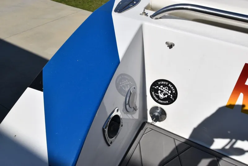 Slide: The Image of Close-up of a 2002 Black Thunder 460 EC boat's stern with stickers. - 7