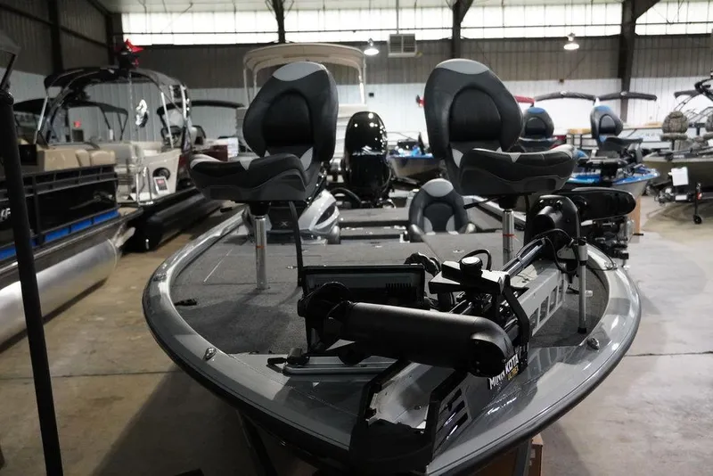 Slide: The Image of 2024 Vexus AVX1980C fishing boat in showroom, featuring dual seats and advanced equipment. - 5