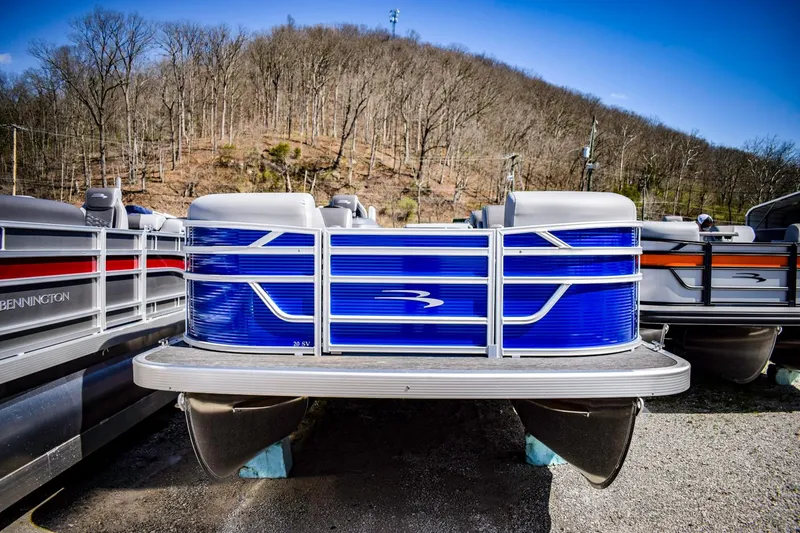 Slide: The Image of 2024 Bennington 20 SVLSR pontoon boat in a storage yard. - 3