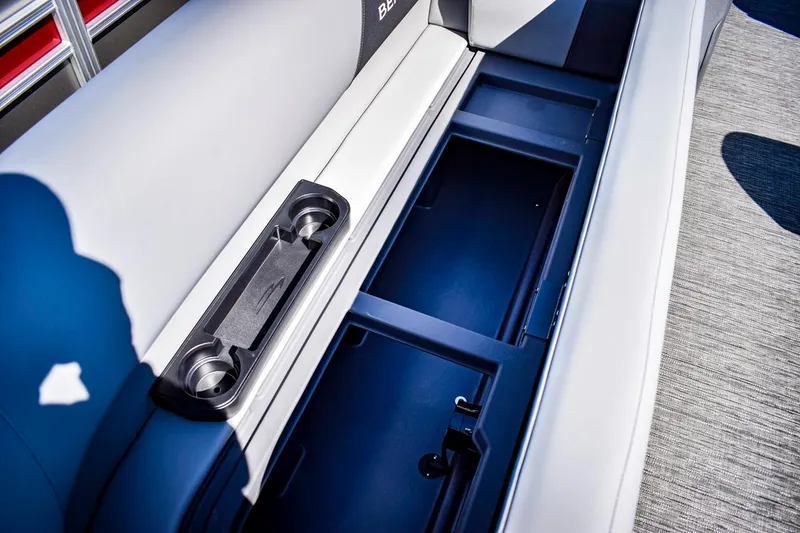 Slide: The Image of 2024 Bennington 20 SVLSR boat interior storage compartment with cup holders. - 7