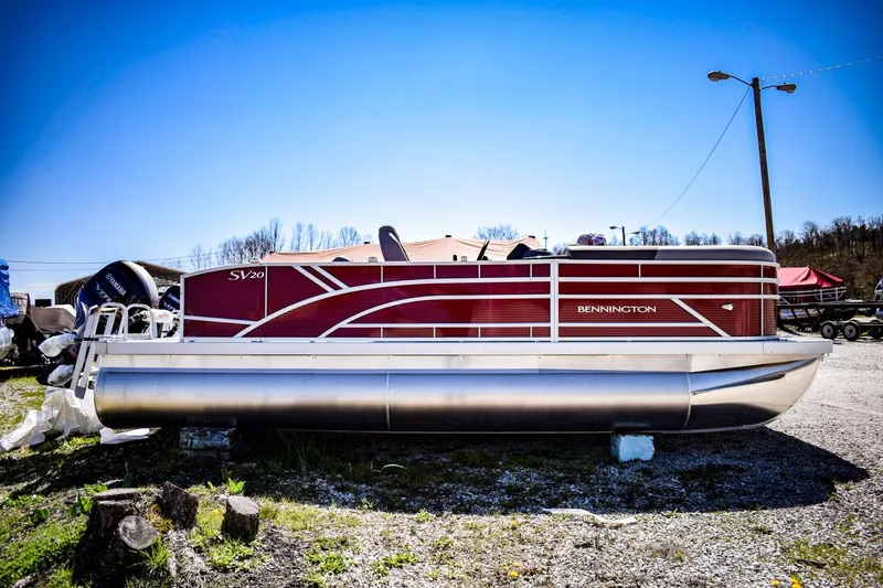 Slide: The Image of 2024 Bennington 20 SVSBSR pontoon boat in a lot. - 1