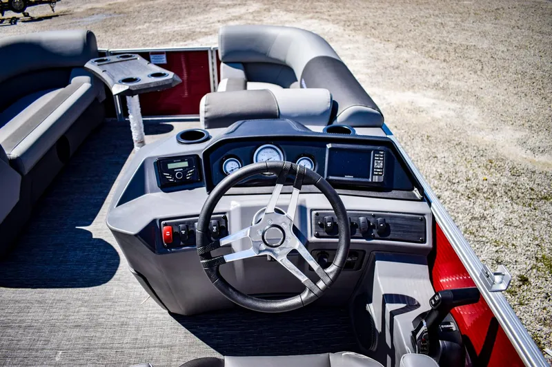 Slide: The Image of 2024 Bennington 20 SVSBSR pontoon boat interior with steering wheel and dashboard. - 11