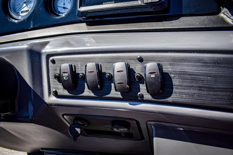 Slide: The Image of Control panel of 2024 Bennington 20 SVSBSR boat with switches and gauges. - 16