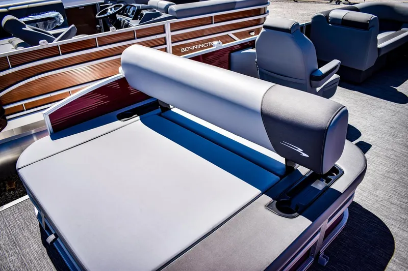 Slide: The Image of 2024 Bennington 20 SVSBSR pontoon boat with luxurious seating and modern design. - 20