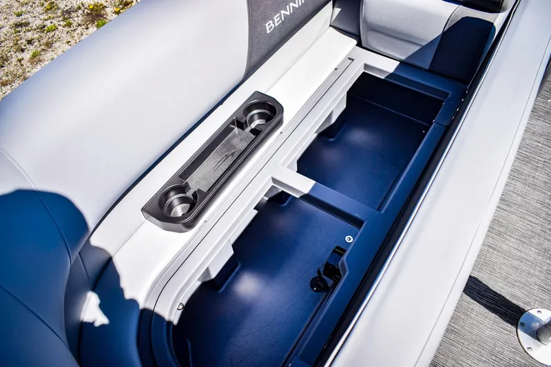 Slide: The Image of 2024 Bennington 20 SVSBSR boat storage compartment with cup holders. - 7