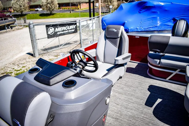Slide: The Image of 2024 Bennington 20 SVSBSR pontoon boat interior with steering console and seating. - 9