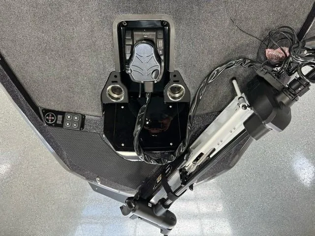 Slide: The Image of iKon LX20 2024 boat deck with trolling motor and foot pedal controls. - 13