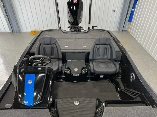 Slide: The Image of 2024 iKon LX20 boat interior with dual seats and steering console. - 14