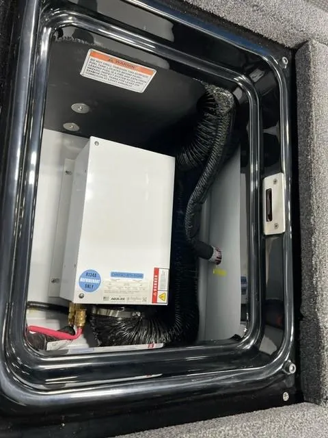 Slide: The Image of 2024 iKon LX20 electrical compartment with wiring and components. - 7