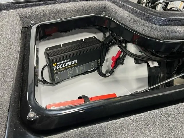 Slide: The Image of iKon LX20 2024 model boat battery compartment with Minn Kota Precision charger. - 8