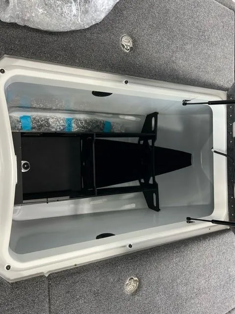 Slide: The Image of iKon LX20 2024 boat storage compartment with black frame and gray interior. - 10