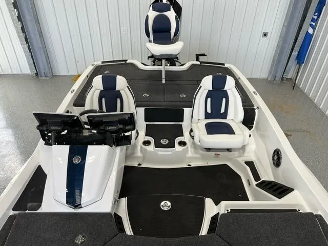 Slide: The Image of 2024 iKon LX20 boat interior with three seats and control panel. - 13