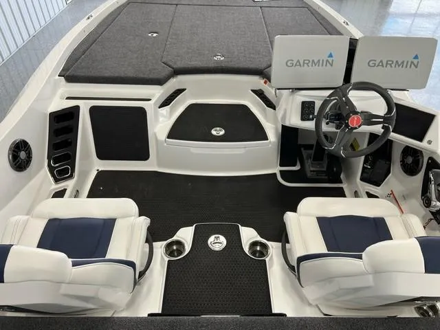 Slide: The Image of iKon LX20 2024 boat interior with Garmin navigation system, dual seats, and steering wheel. - 7