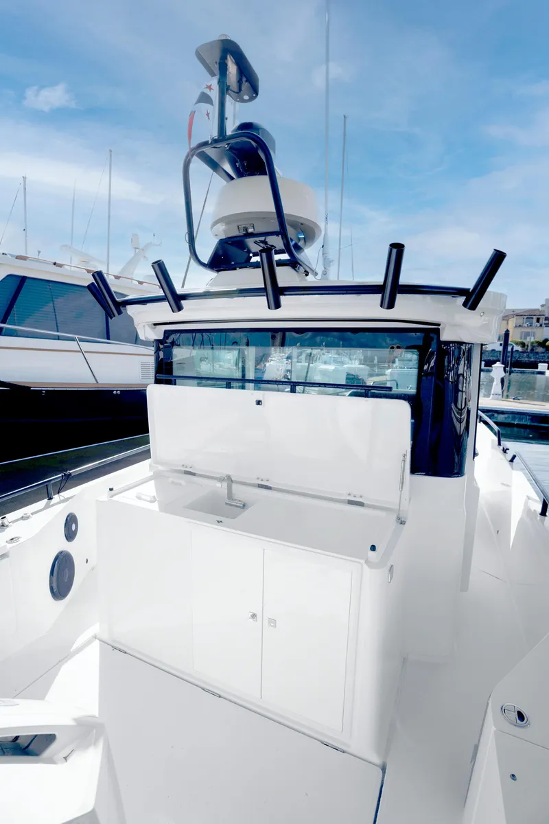 Slide: The Image of 2022 Axopar 28 CABIN boat with sleek design and modern amenities. - 23