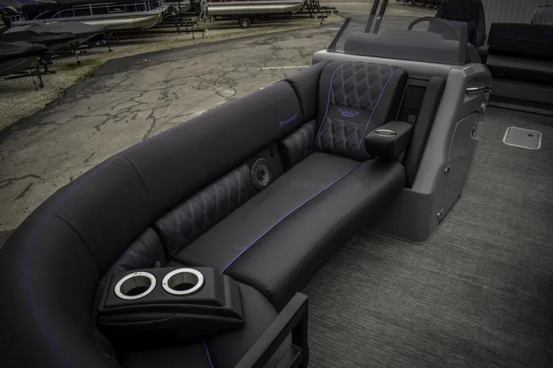 Slide: The Image of 2024 Bennington 23 RSBSR luxury boat interior with black seating and cup holders. - 12