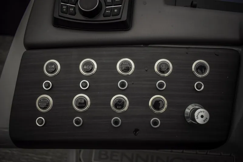 Slide: The Image of Control panel of 2024 Bennington 23 RSBSR boat with various buttons and switches. - 6