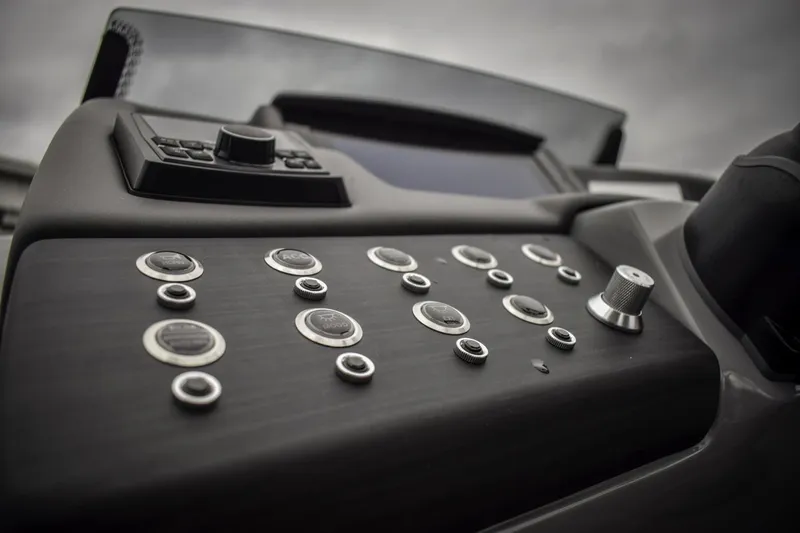 Slide: The Image of Control panel of the 2024 Bennington 23 RSBSR boat with various buttons and switches. - 7