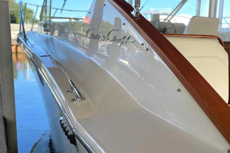 Slide: The Image of 1977 Chris-Craft 30 Sportsman boat with sleek design and polished wood accents. - 4
