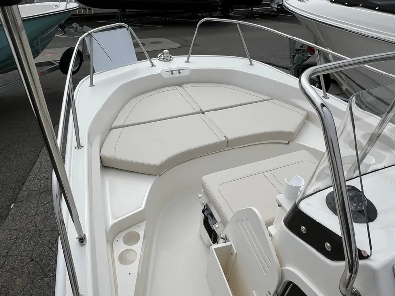 Slide: The Image of 2024 Boston Whaler 170 Montauk boat interior with cushioned seating. - 5