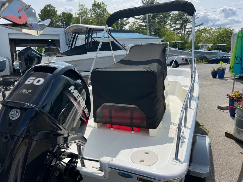 Slide: The Image of 2024 Boston Whaler 150 Montauk boat with Mercury 50 GT engine, outdoor display. - 3