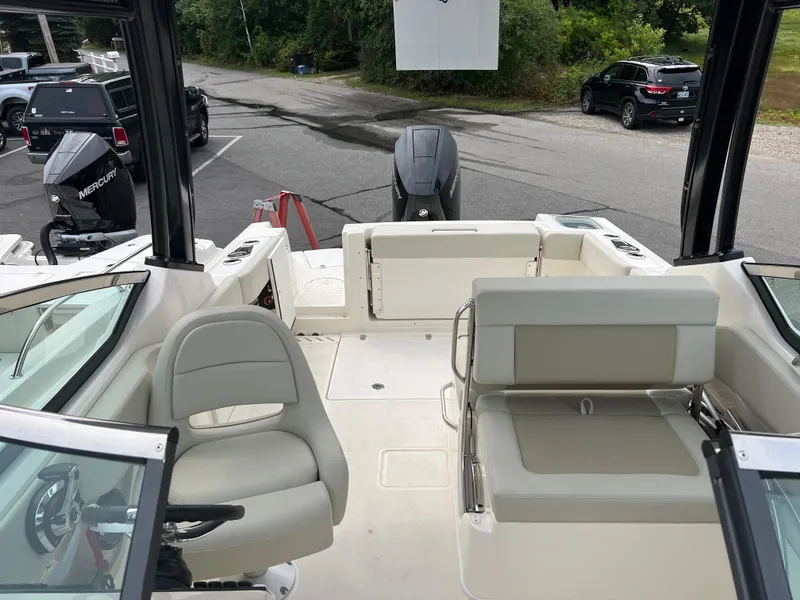 Slide: The Image of 2024 Boston Whaler 240 Vantage boat interior with seating and outboard motor. - 3