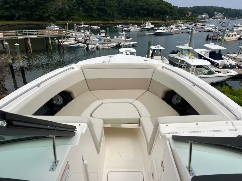 Slide: The Image of 2024 Boston Whaler 240 Vantage boat interior with marina view. - 5