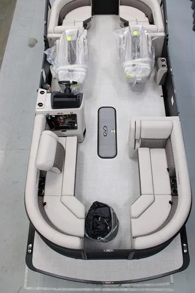 Slide: The Image of 2024 Harris FloteBote Sunliner 230 pontoon boat interior with plush seating. - 2