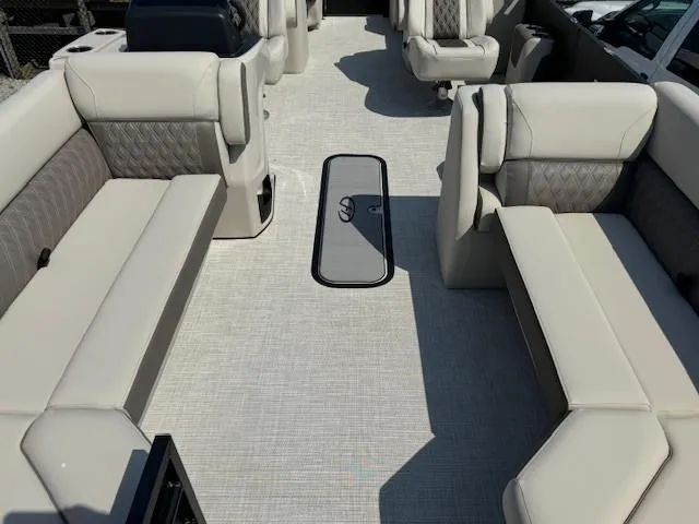 Slide: The Image of 2024 Harris FloteBote Sunliner 230 interior with spacious seating and modern design. - 4