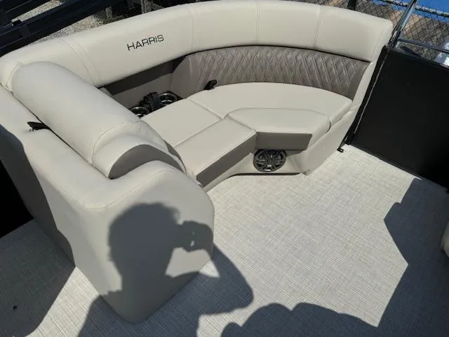 Slide: The Image of 2024 Harris FloteBote Sunliner 230 boat interior with luxurious seating. - 7