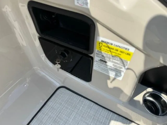 Slide: The Image of Control panel and capacity label of 2024 Harris FloteBote Sunliner 230 pontoon boat. - 8