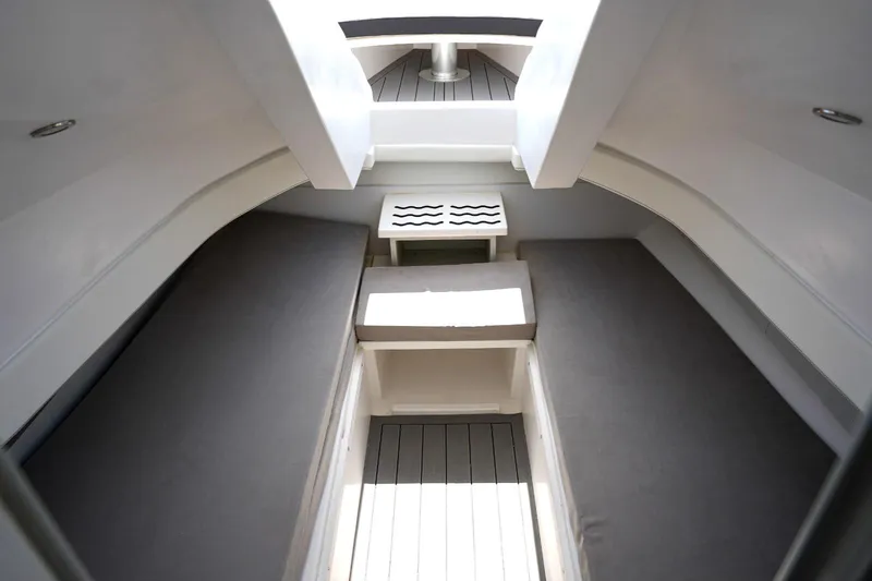 Slide: The Image of Interior cabin of 2025 Panamera Yacht PY 100 with grey seating and wooden flooring. - 18