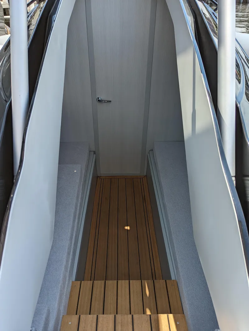 Slide: The Image of Interior view of 2025 Panamera Yacht PY 100 with wooden flooring and seating. - 19