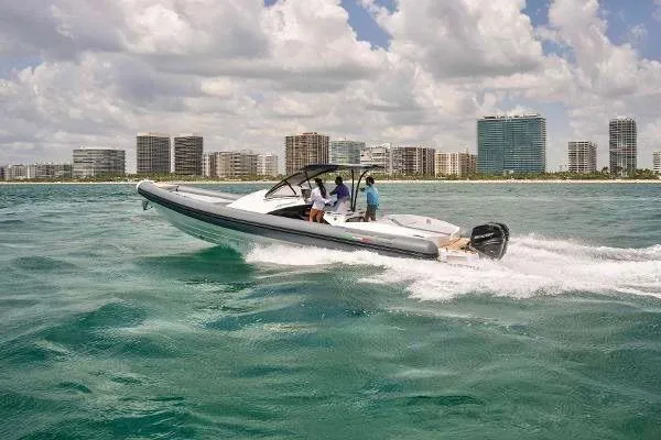 Slide: The Image of 2025 Panamera Yacht PY 100 cruising near a coastal city skyline. - 27