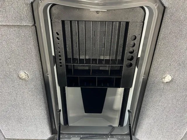 Slide: The Image of 2024 iKon LX21 storage compartment with organized slots and grey interior. - 11