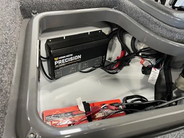Slide: The Image of iKon LX21 2024 boat battery compartment with Minn Kota Precision charger. - 5