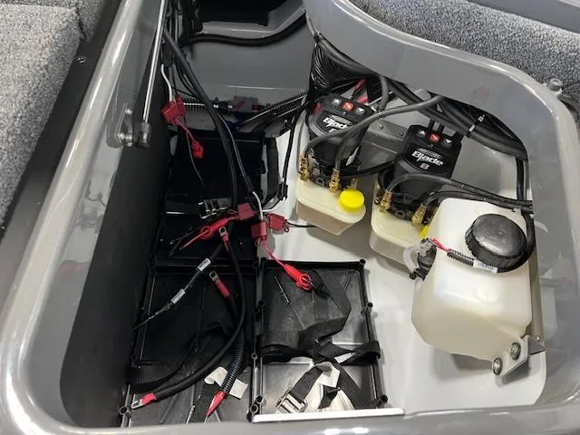 Slide: The Image of iKon LX21 2024 boat battery compartment with wiring and fluid reservoirs. - 6