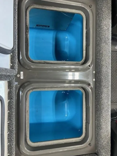 Slide: The Image of iKon LX21 2024 dual blue storage compartments in a boat. - 7