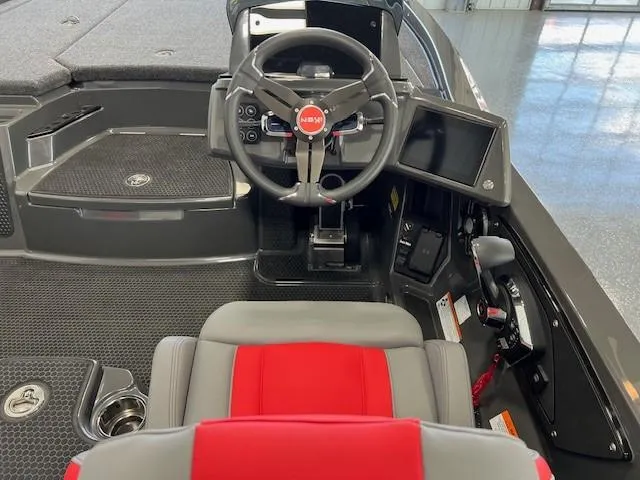 Slide: The Image of iKon LX21 2024 boat cockpit with steering wheel, red and gray seat, and control panel. - 8