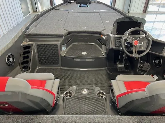 Slide: The Image of 2024 iKon LX21 boat interior with dual seats, steering console, and storage compartments. - 9