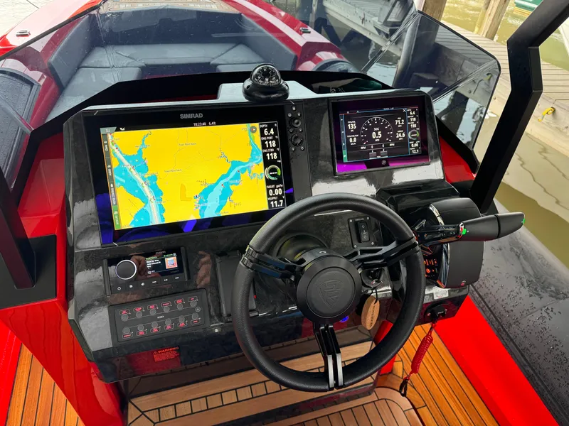 Slide: The Image of Control panel of the 2024 SuperRib Open 30 boat with navigation screens. - 19