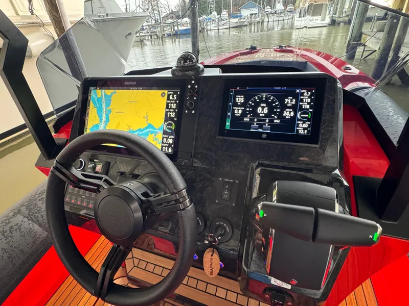 Slide: The Image of 2024 SuperRib Open 30 boat dashboard with navigation and control systems. - 20