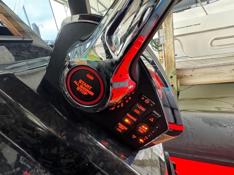 Slide: The Image of Close-up of 2024 SuperRib Open 30 boat control panel with illuminated buttons. - 21