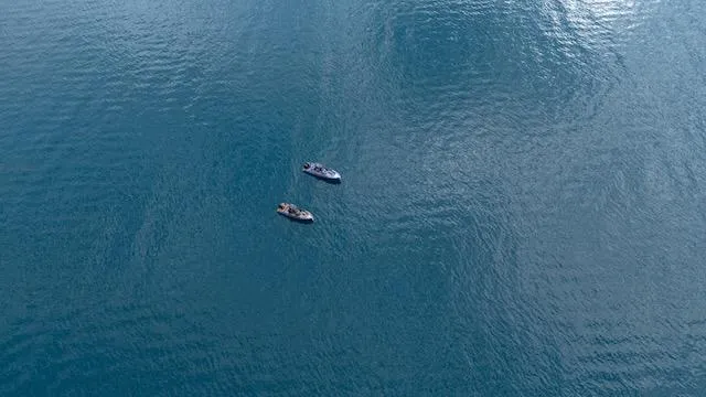 Slide: The Image of Two boats on calm blue water, featuring a 2025 SuperRib Open 30 model. - 25