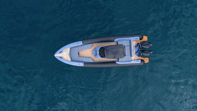 Slide: The Image of Aerial view of 2025 SuperRib Open 30 boat on blue water. - 28