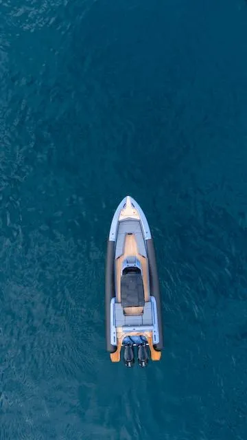 Slide: The Image of Aerial view of 2025 SuperRib Open 30 boat on blue water. - 30